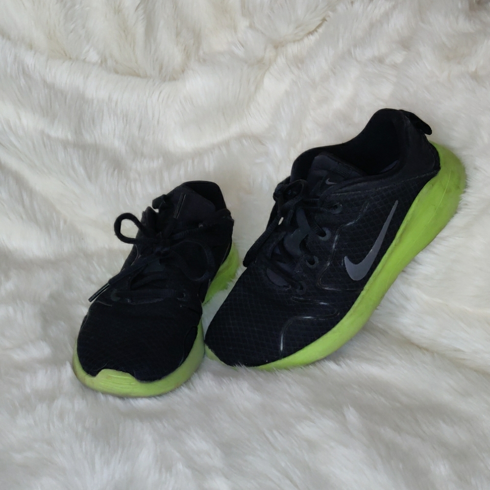 Black and neon green Nikes